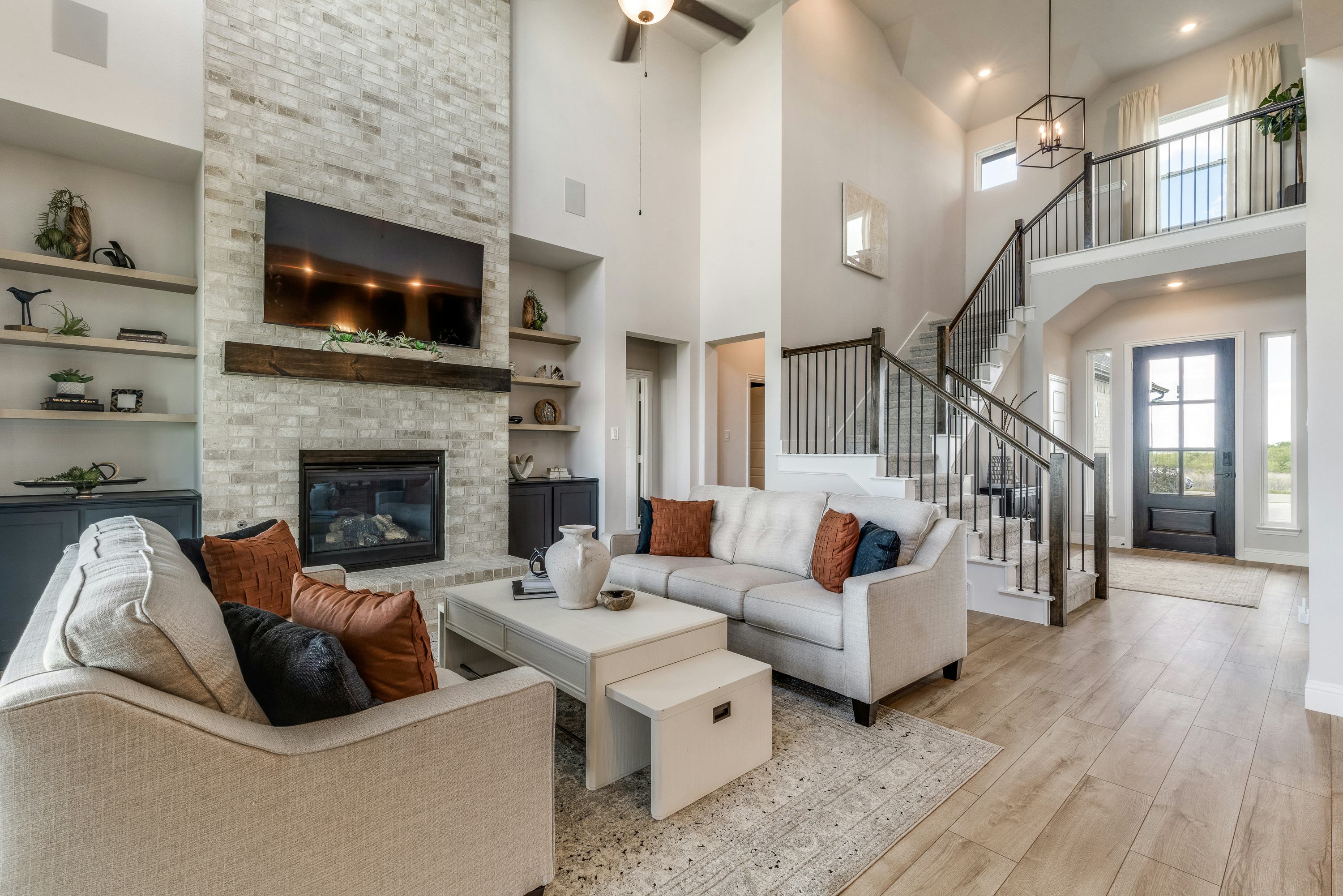 Living room and staircase of Berkshire Estates home in Mesquite, TX by Kindred Homes