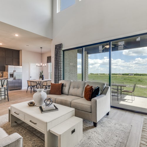 Living room and kitchen of Berkshire Estates home in Mesquite, TX by Kindred Homes