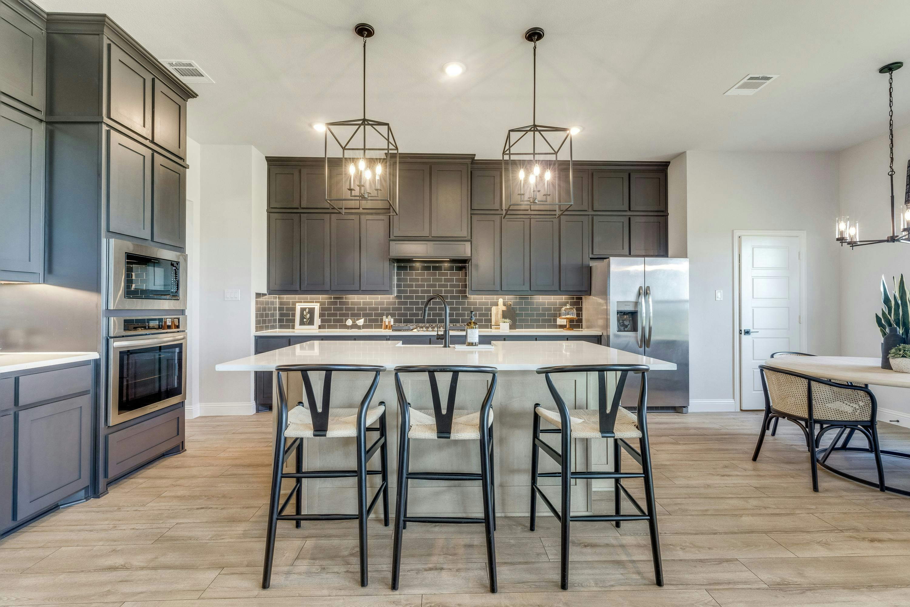 Kitchen and dining room of Berkshire Estates home in Mesquite, TX by Kindred Homes