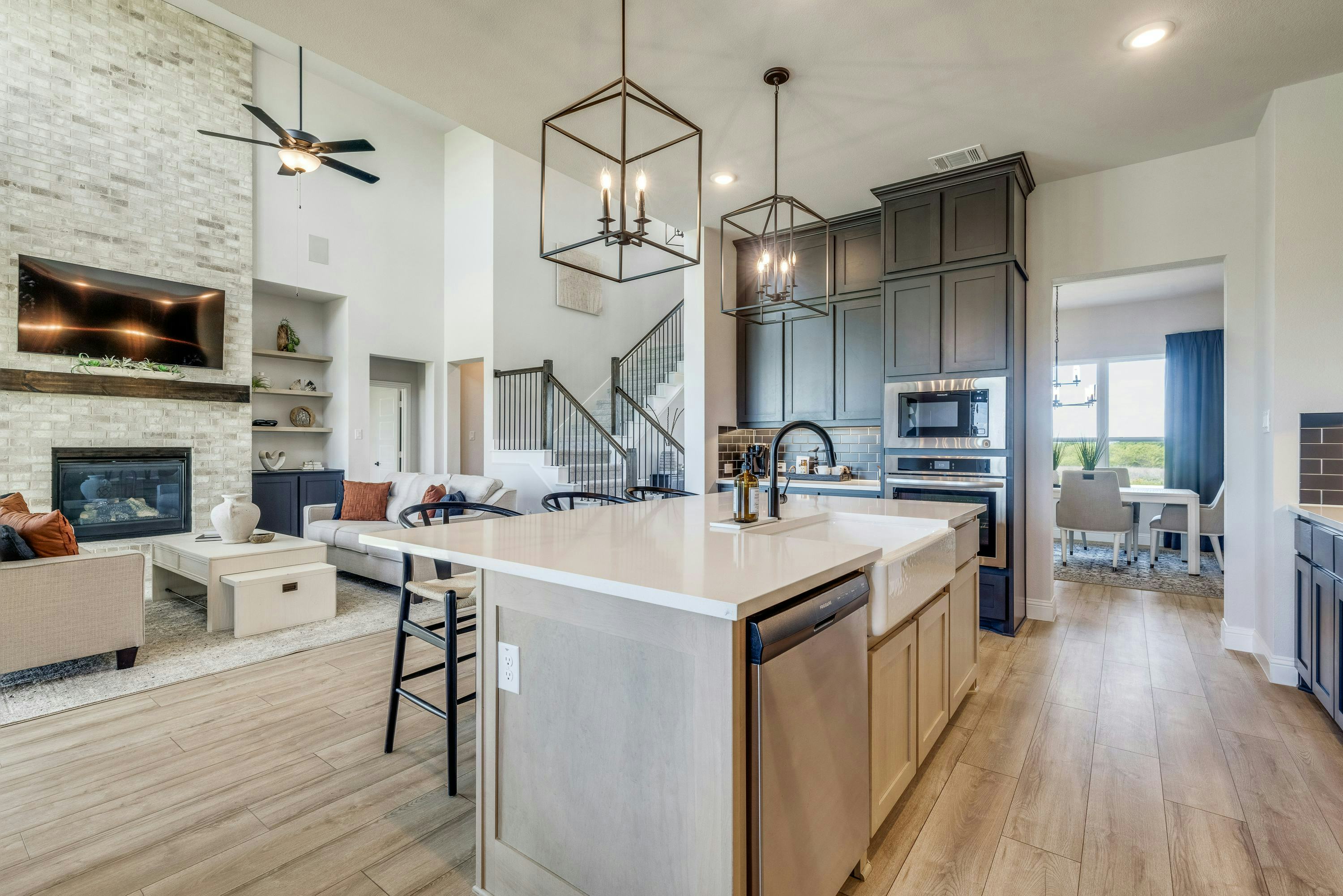 Kitchen and living room of Berkshire Estates home in Mesquite, TX by Kindred Homes