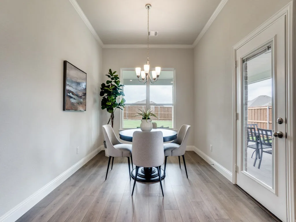 Breakfast nook in modern farmhouse transitional style home by Kindred Homes