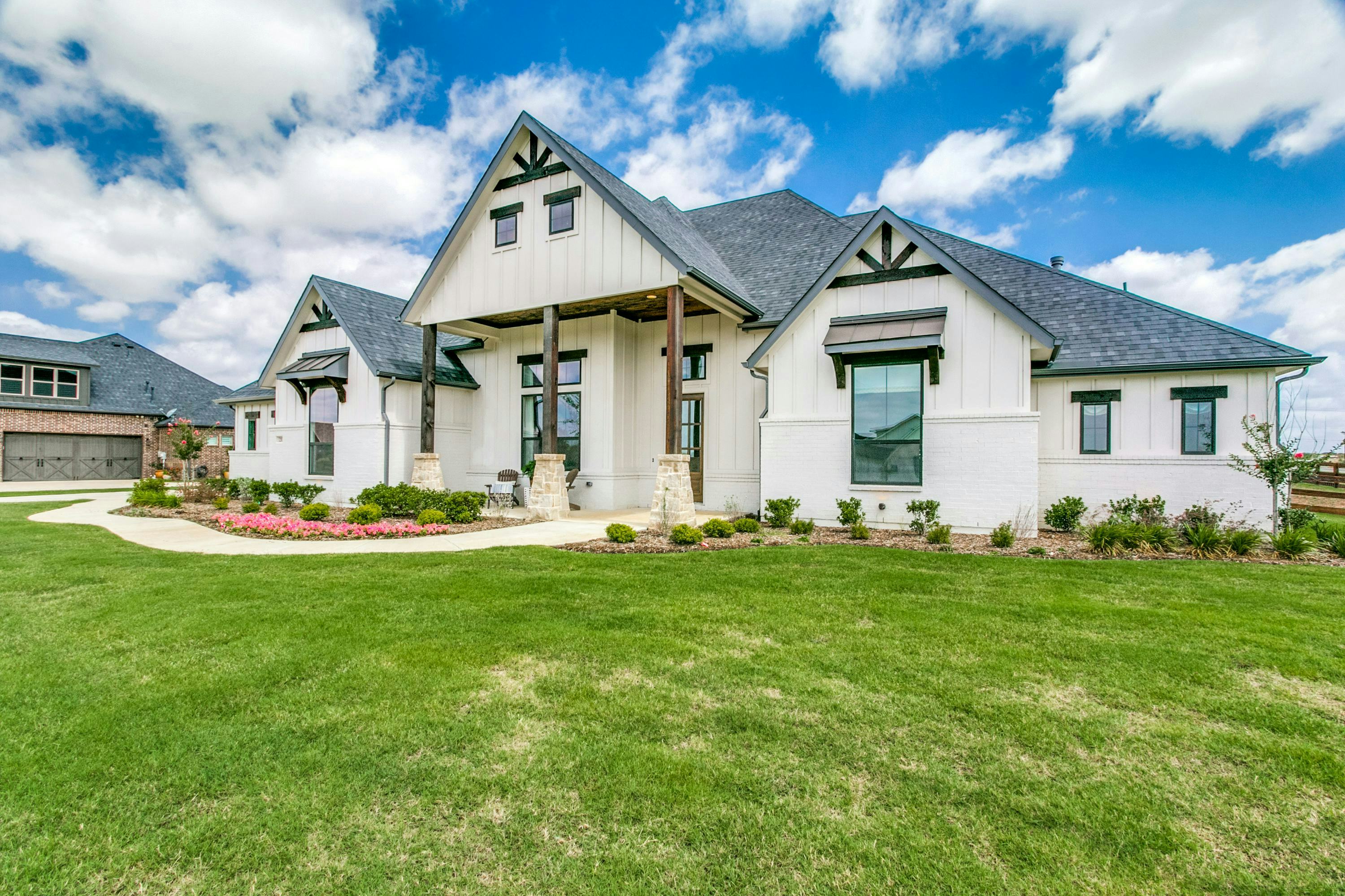 Side view of The Highlands of Northlake home in Northlake, TX by Kindred Homes