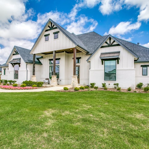 Side view of The Highlands of Northlake home in Northlake, TX by Kindred Homes