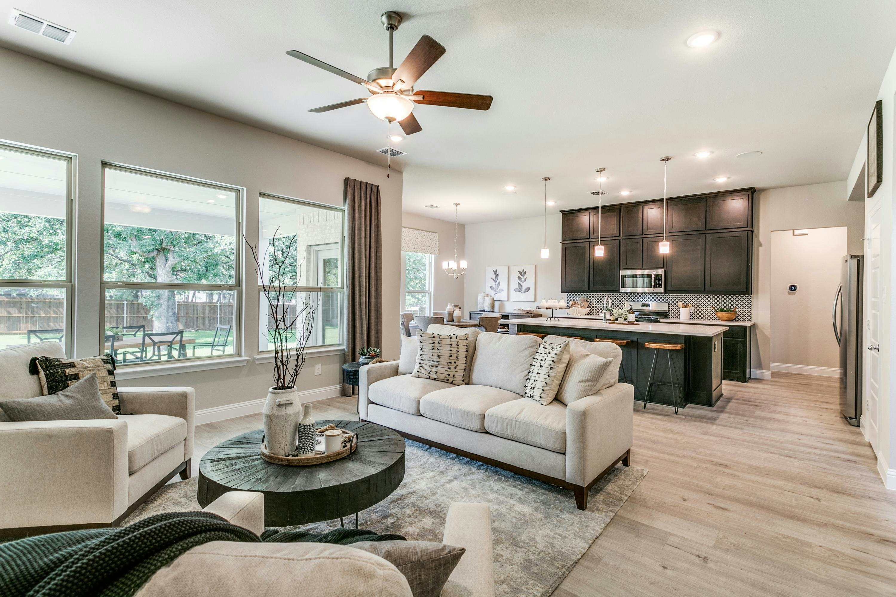 Living room and kitchen of Stone Eagle home in Azle, TX by Kindred Homes