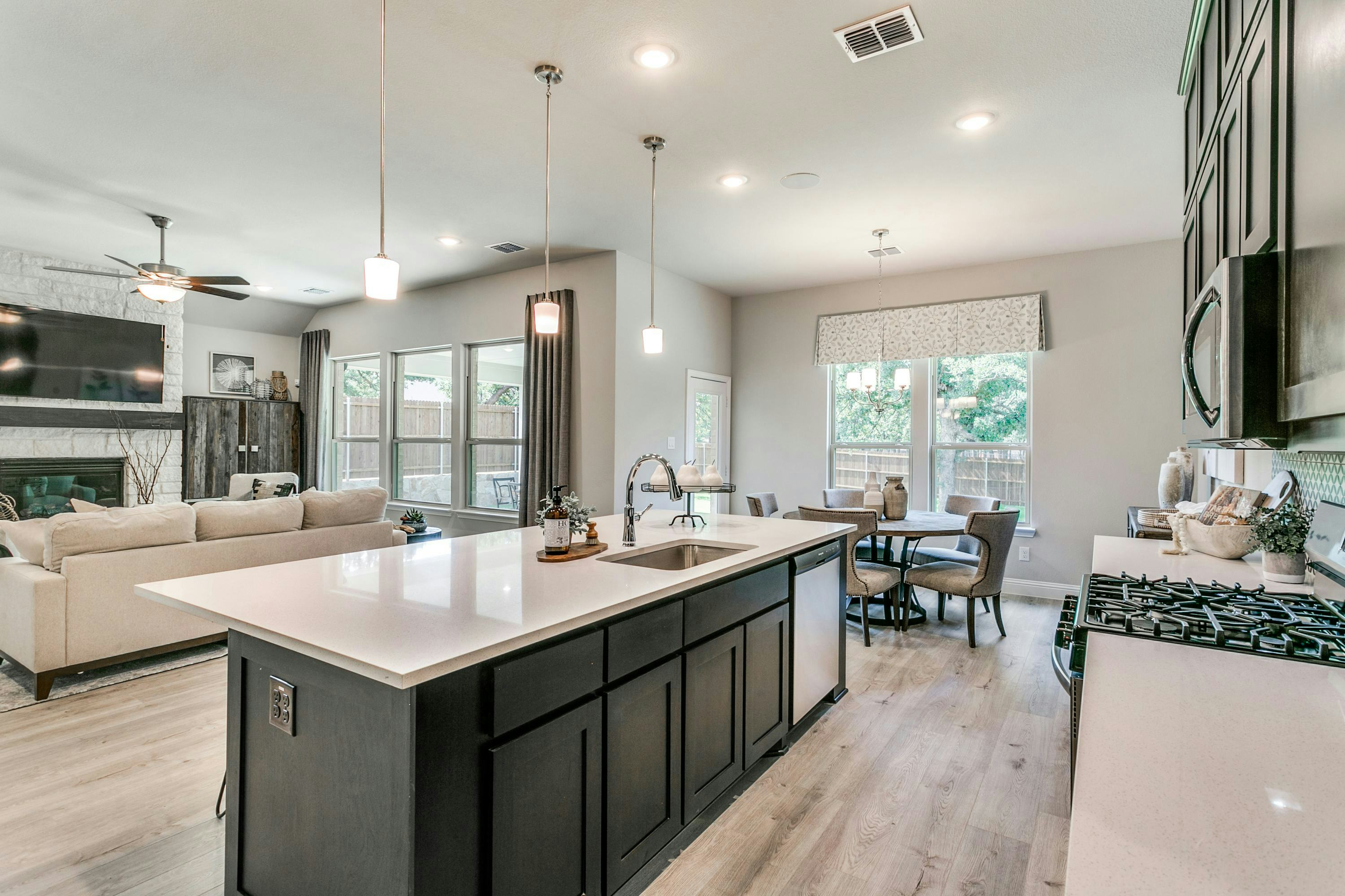 Kitchen and dining room of Stone Eagle home in Azle, TX by Kindred Homes