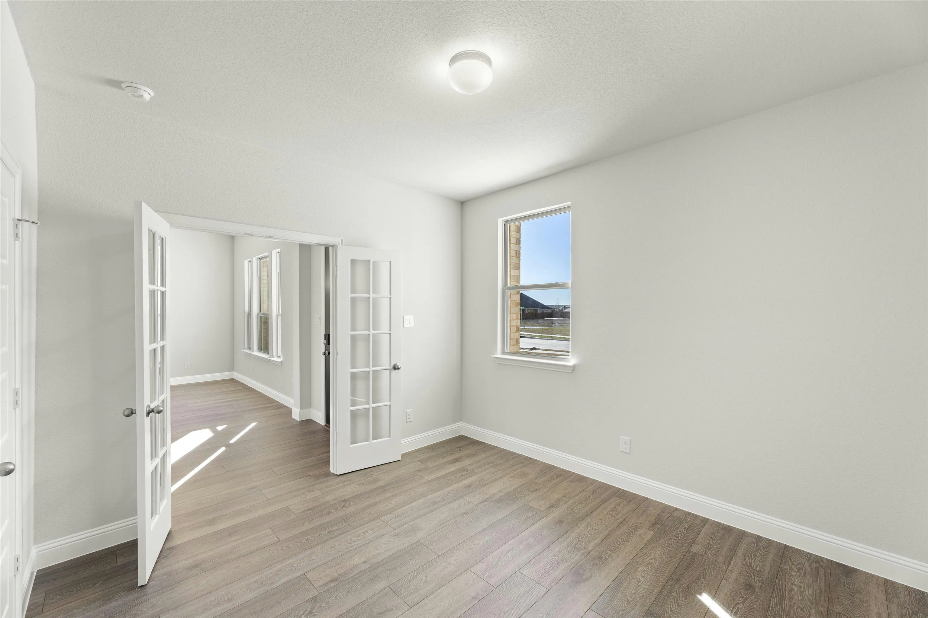 Study in a transitional ranch style home by Kindred Homes