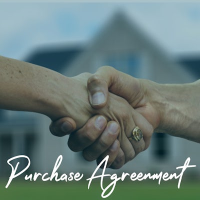 Two people shaking hands to illustrate a purchase agreement has been signed