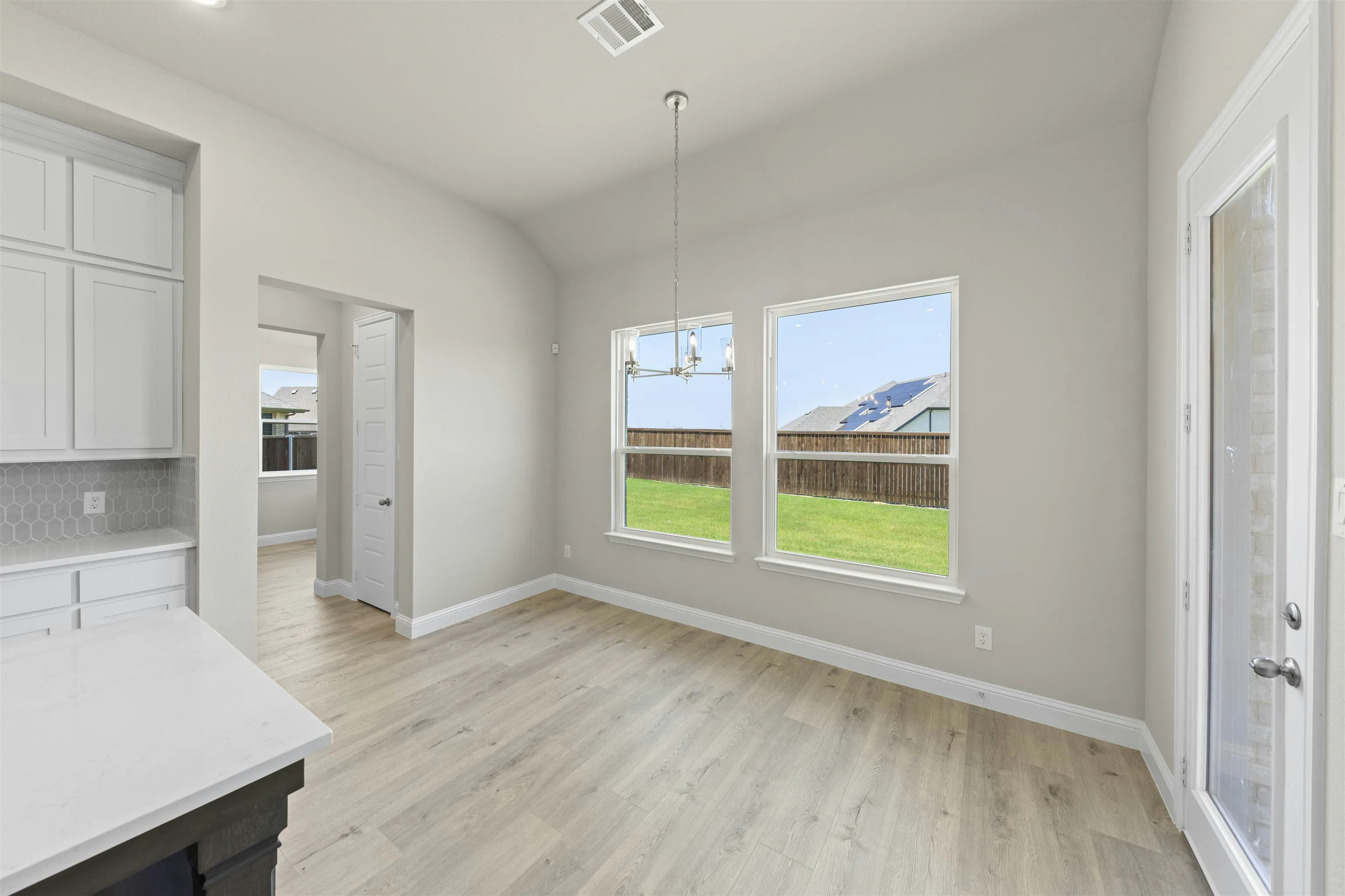 Pocket office in a transitional ranch style home by Kindred Homes