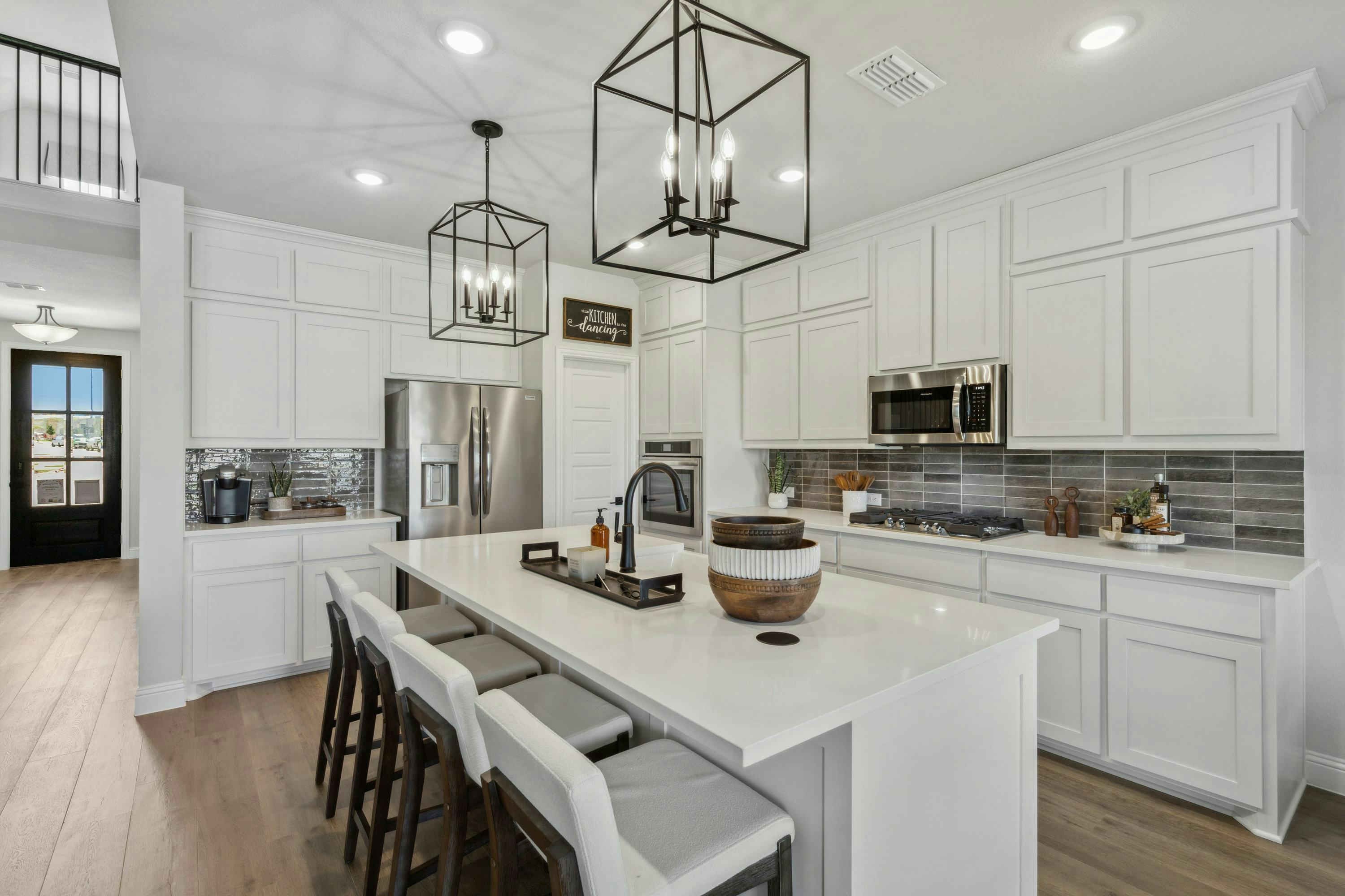 Westside Preserve home kitchen in Midlothian, TX by Kindred Homes