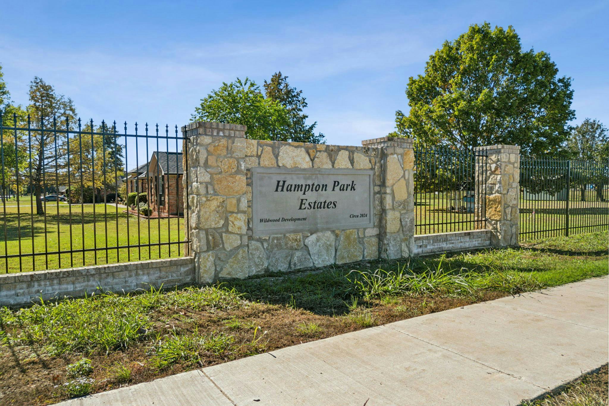 Hampton Park Estates sign and gate in Glenn Heights, TX by Kindred Homes