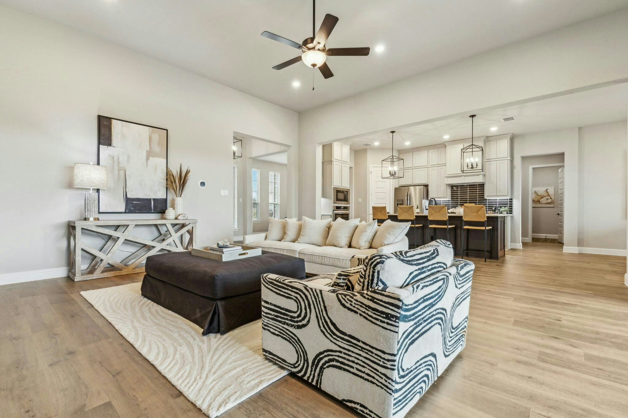 View of Hampton Park Estates living room and kitchen in Glenn Heights, TX by Kindred Homes