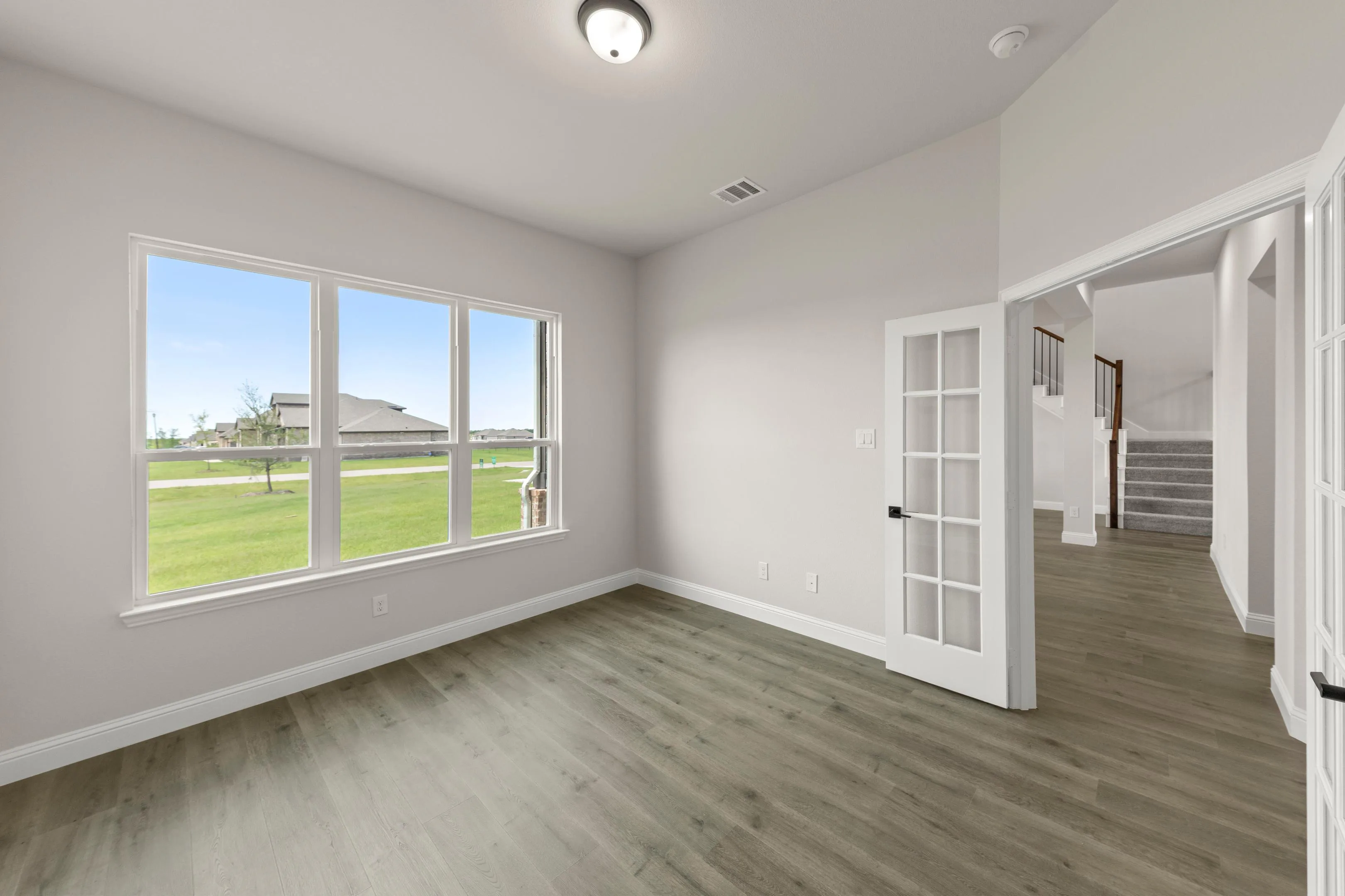 Study in a new traditional style home by Kindred Homes