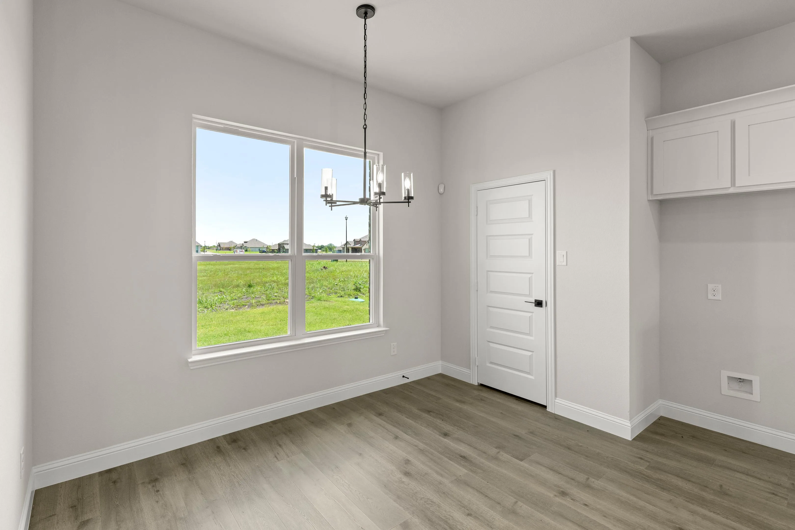 Breakfast nook in a new traditional style home by Kindred Homes