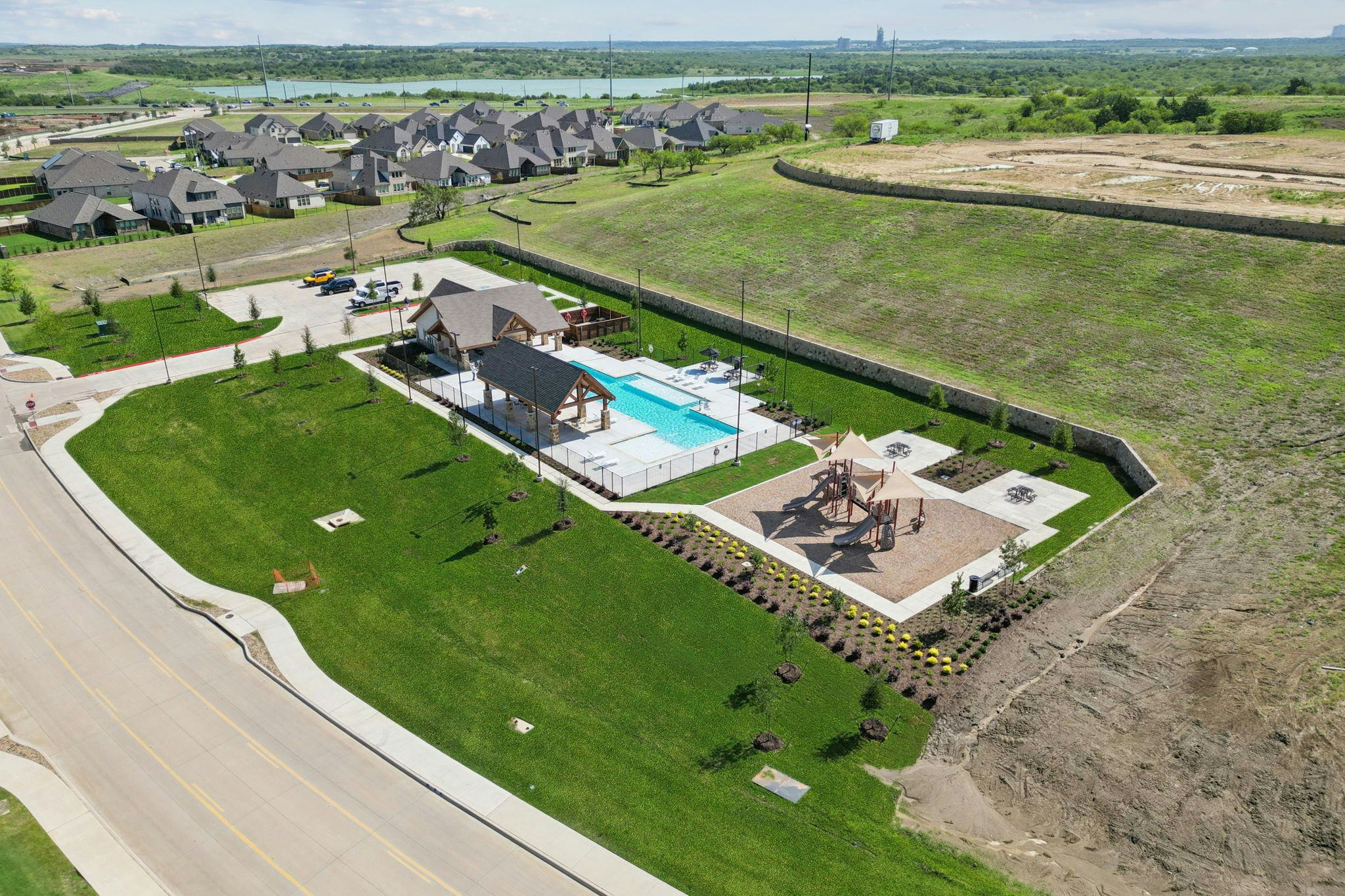 Westside Preserve community pool and playground in Midlothian, TX by Kindred Homes