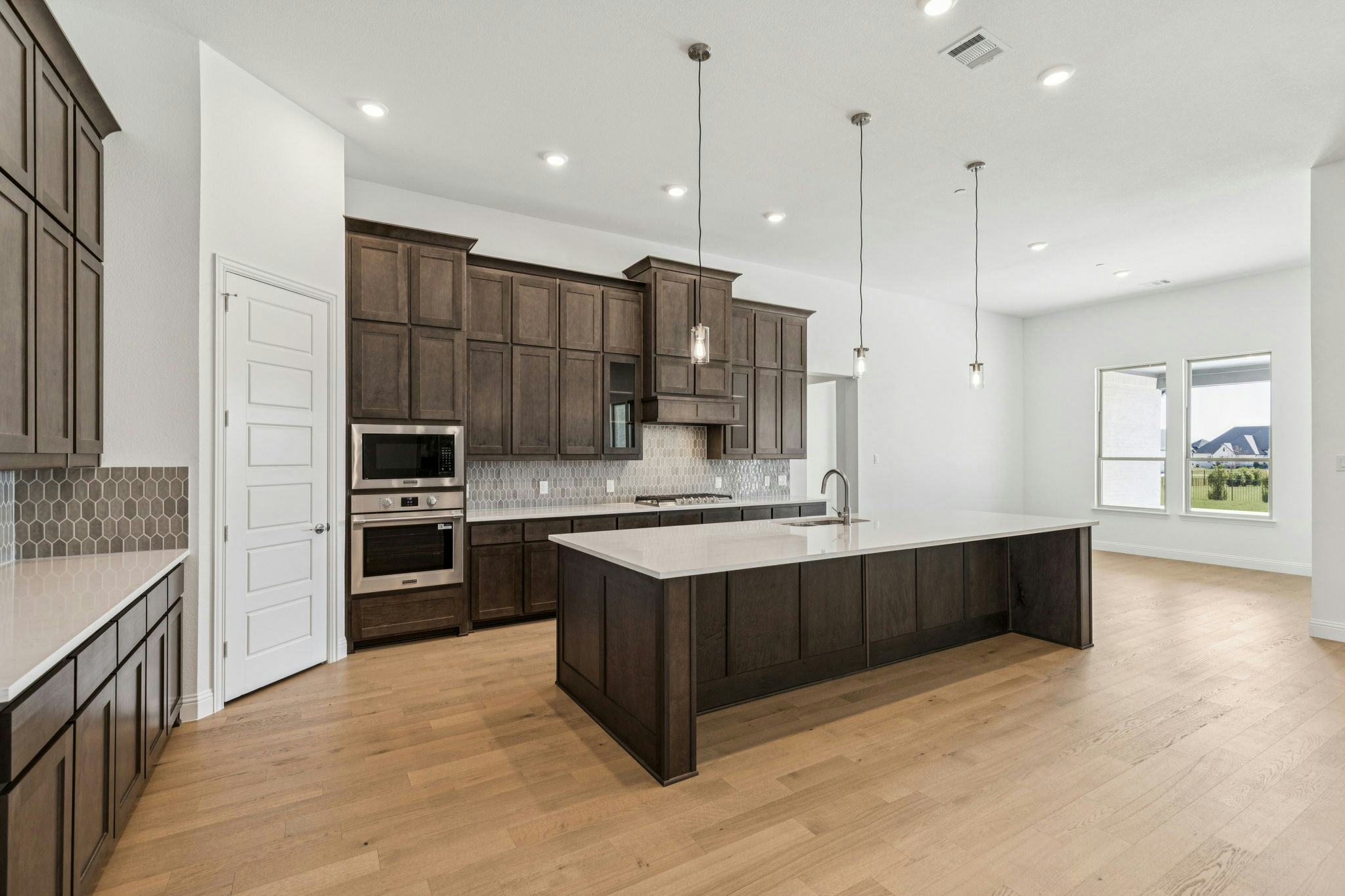 Kitchen and breakfast nook in the Franklin floor plan by Kindred Homes