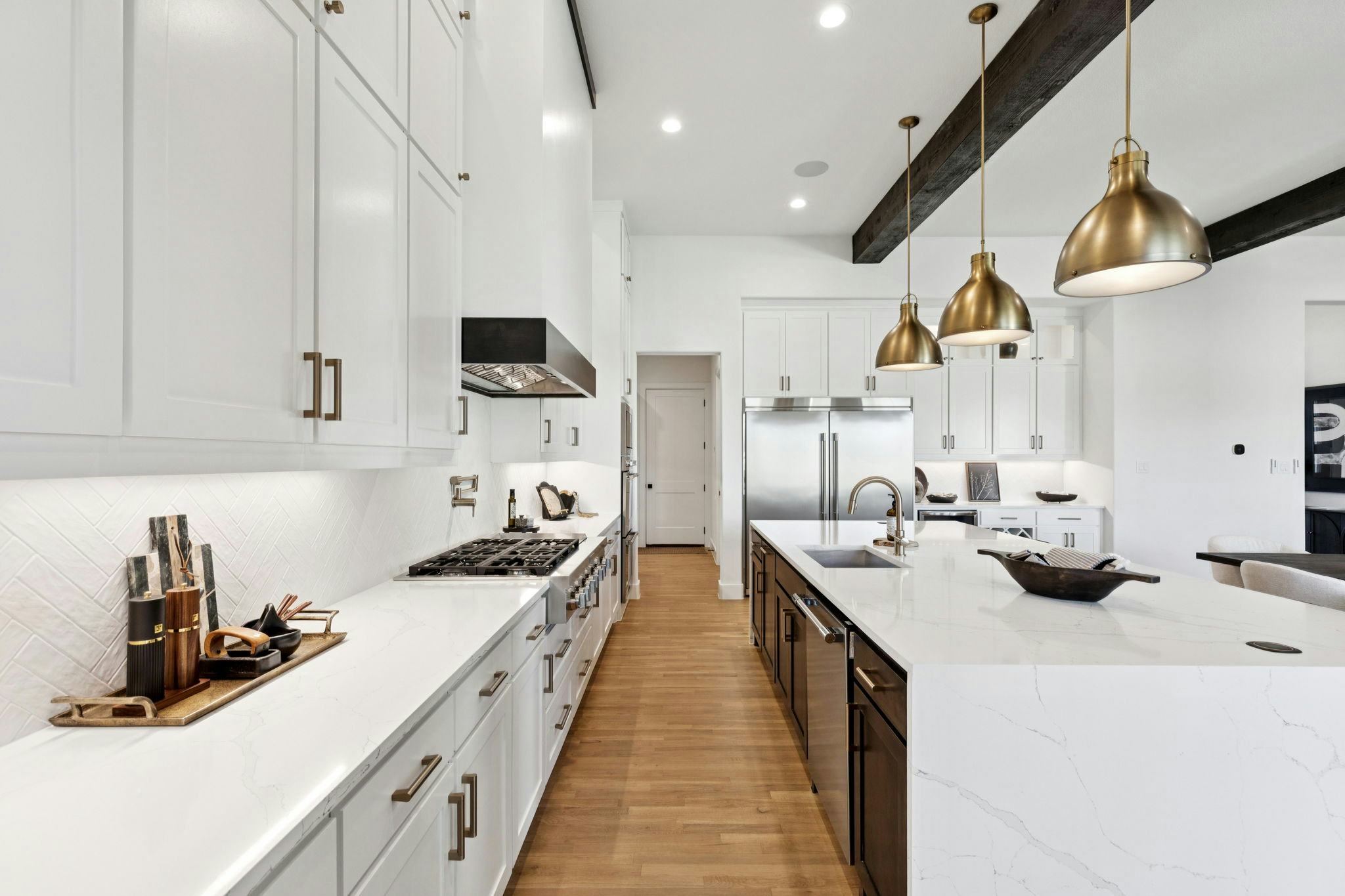 The kitchen in the custom model home at The Vines by Kindred Homes