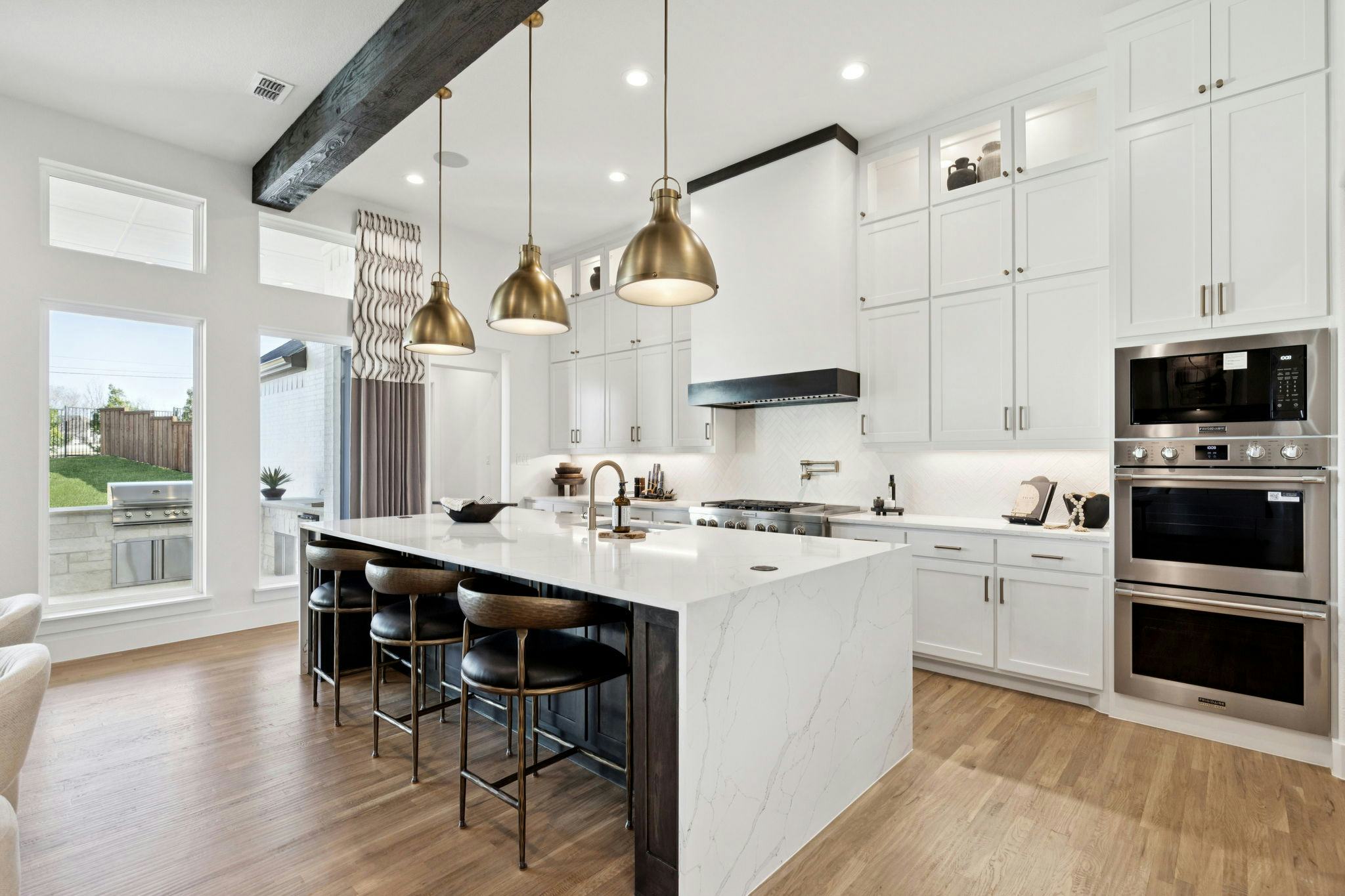 The kitchen in the custom model home at The Vines by Kindred Homes