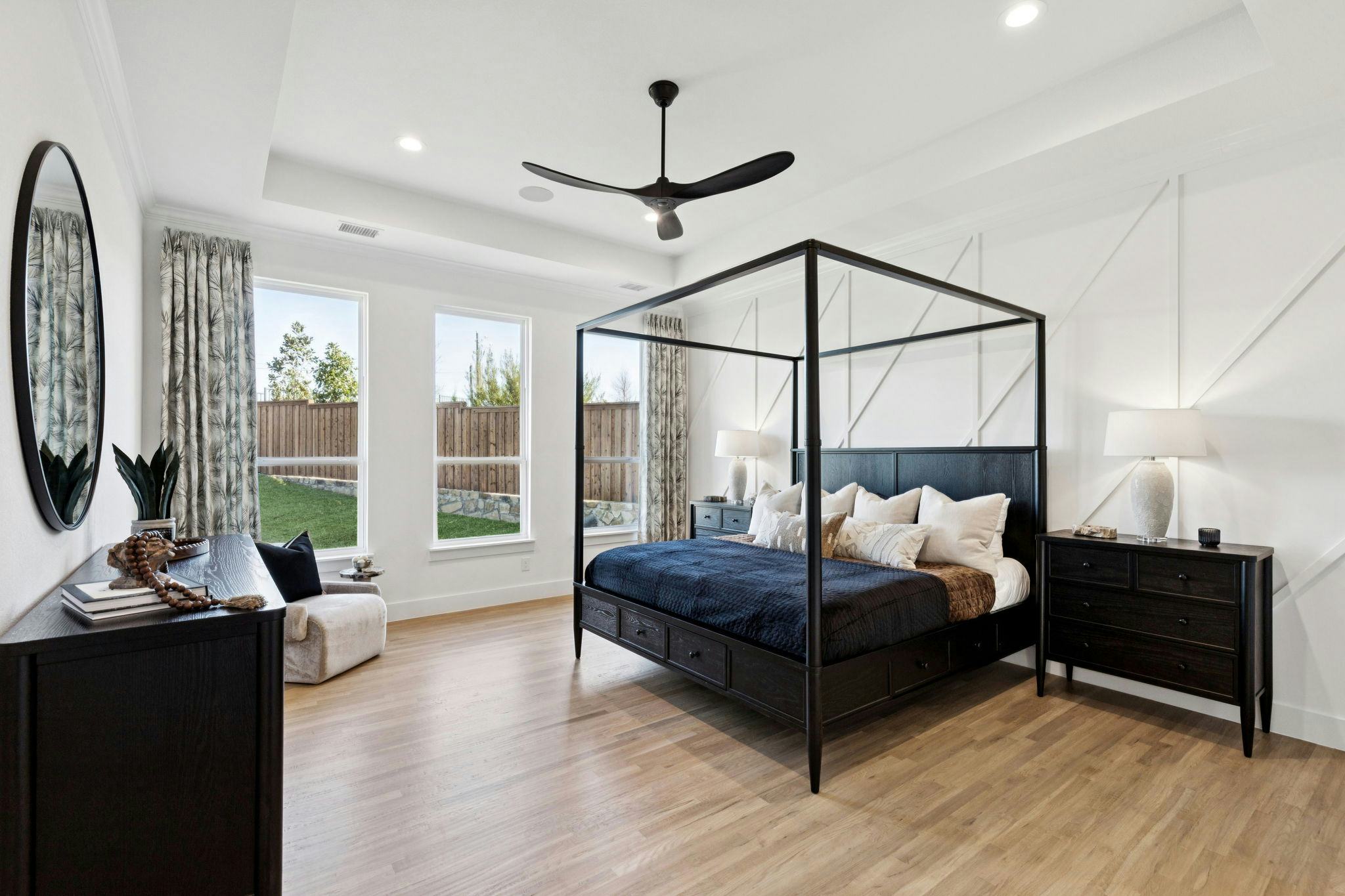 The primary suite bedroom in the custom model home at The Vines by Kindred Homes