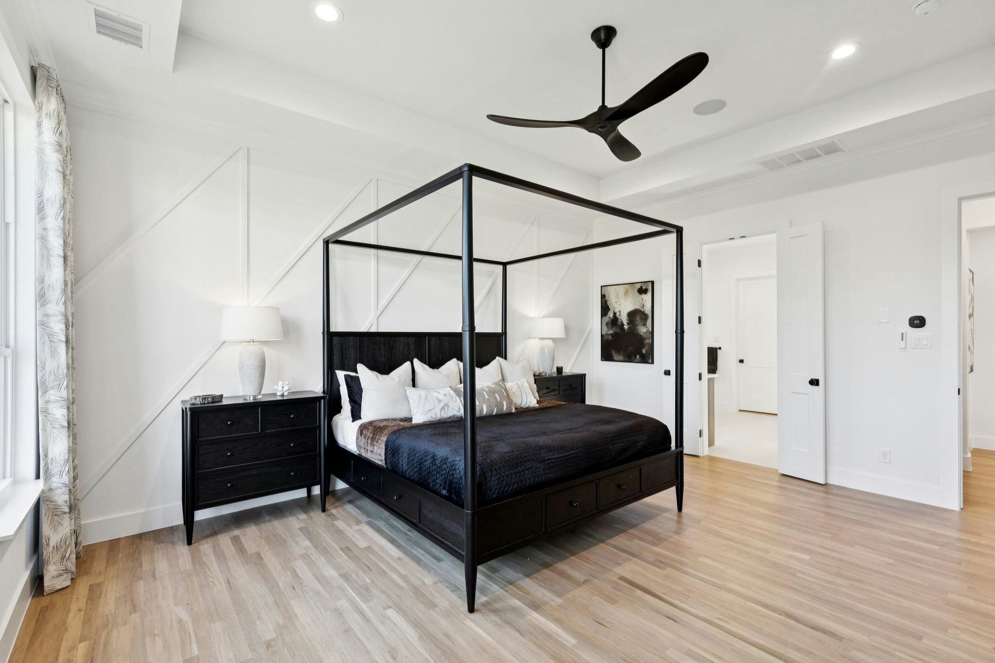 The primary suite bedroom in the custom model home at The Vines by Kindred Homes