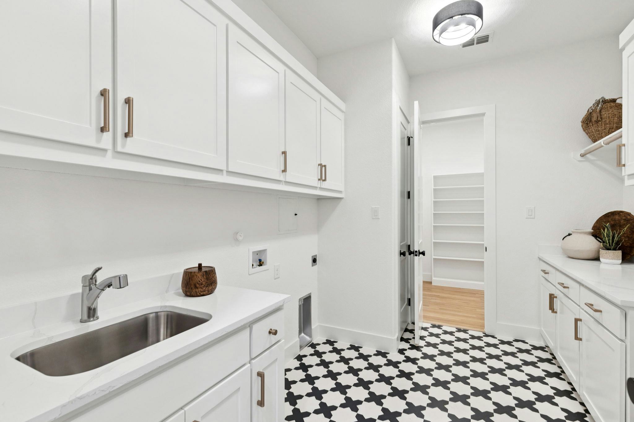 The utility room in the custom model home at The Vines by Kindred Homes