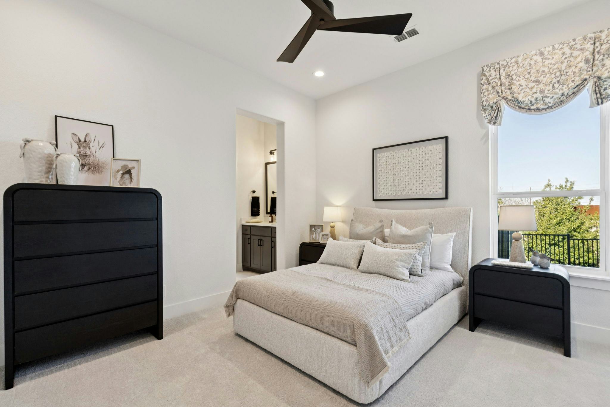 A secondary bedroom in the custom model home at The Vines by Kindred Homes