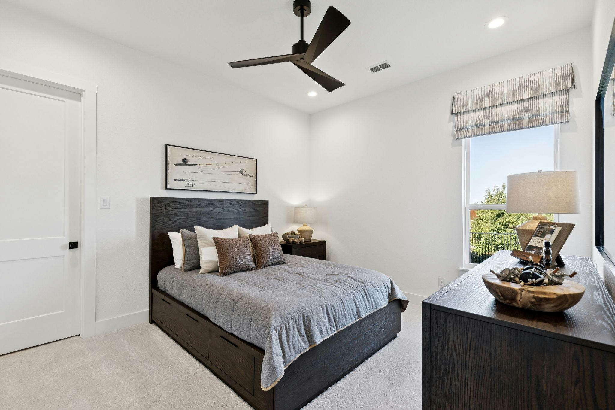 A secondary bedroom in the custom model home at The Vines by Kindred Homes
