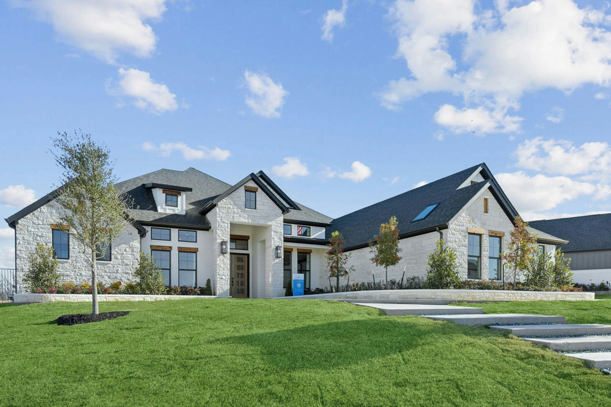 The front exterior of the custom model home at The Vines by Kindred Homes
