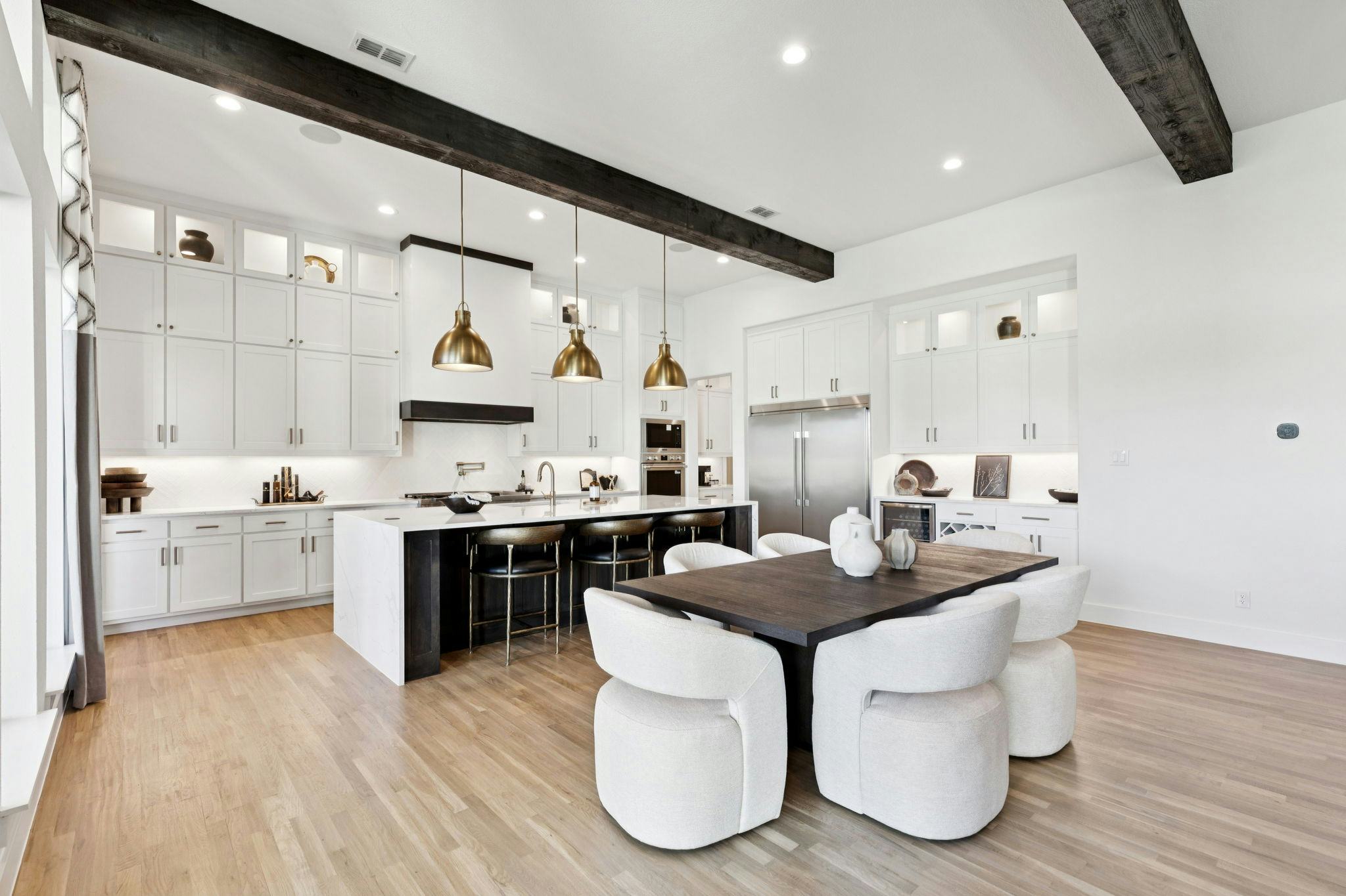 The open concept kitchen in the custom model home at The Vines by Kindred Homes