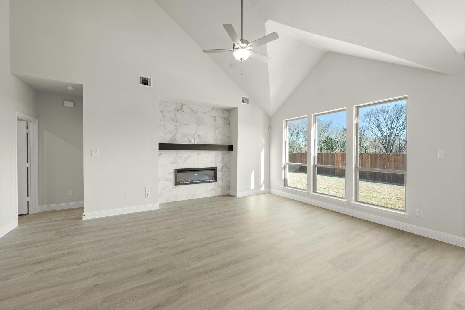 The living room in the Willow floor plan by Kindred Homes