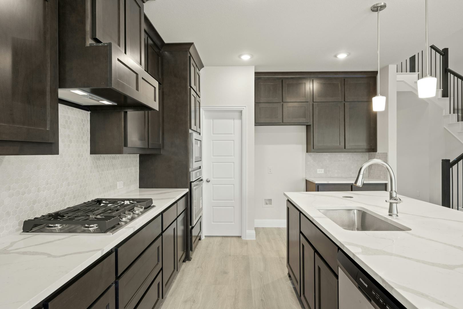 The kitchen in the Willow floor plan by Kindred Homes