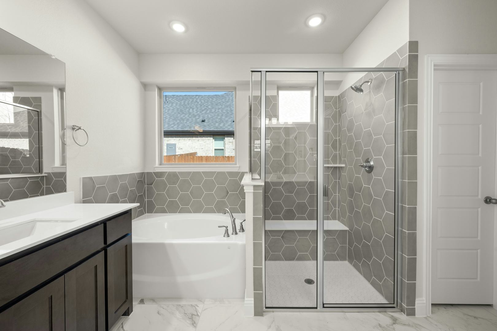 The primary suite bathroom in the Willow floor plan by Kindred Homes