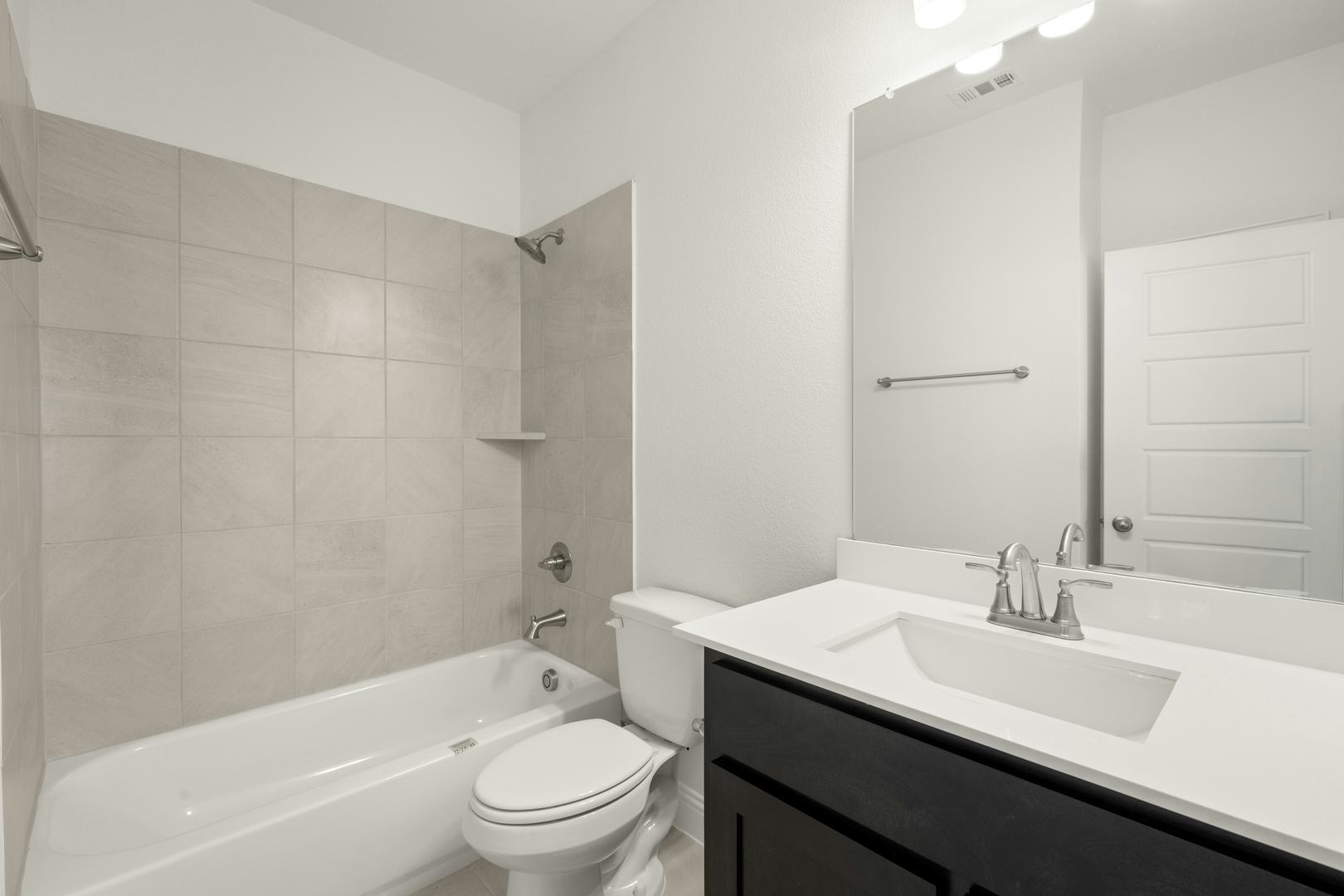 A bathroom in the Cherry floor plan by Kindred Homes