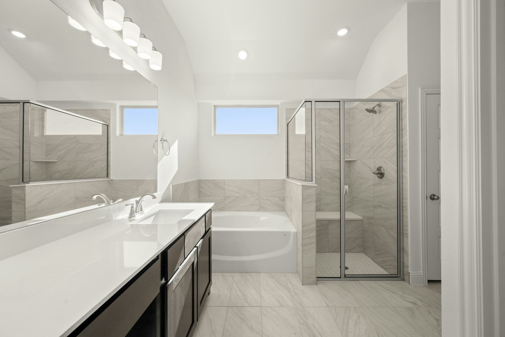 The primary bathroom in the Cherry floor plan by Kindred Homes