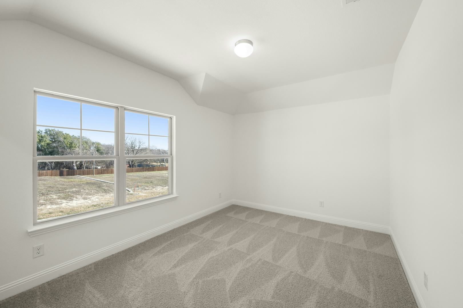 A secondary bedroom in the Cherry floor plan by Kindred Homes