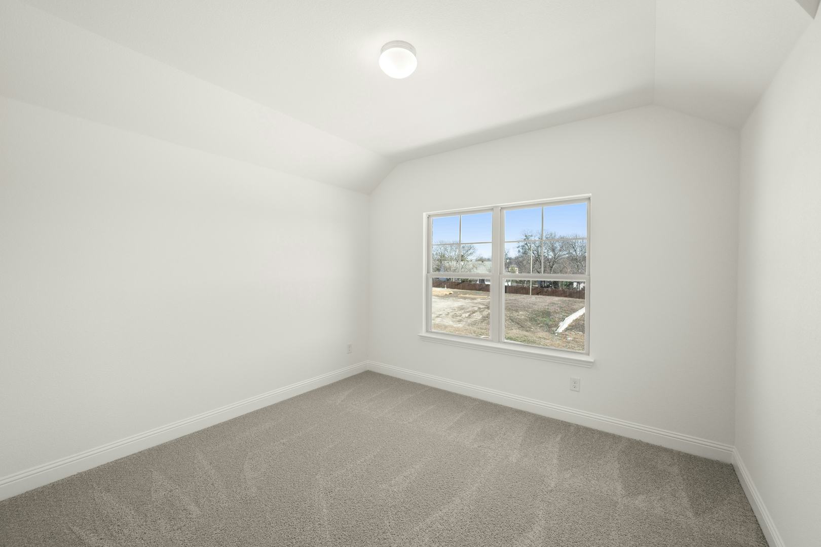 A secondary bedroom in the Cherry floor plan by Kindred Homes