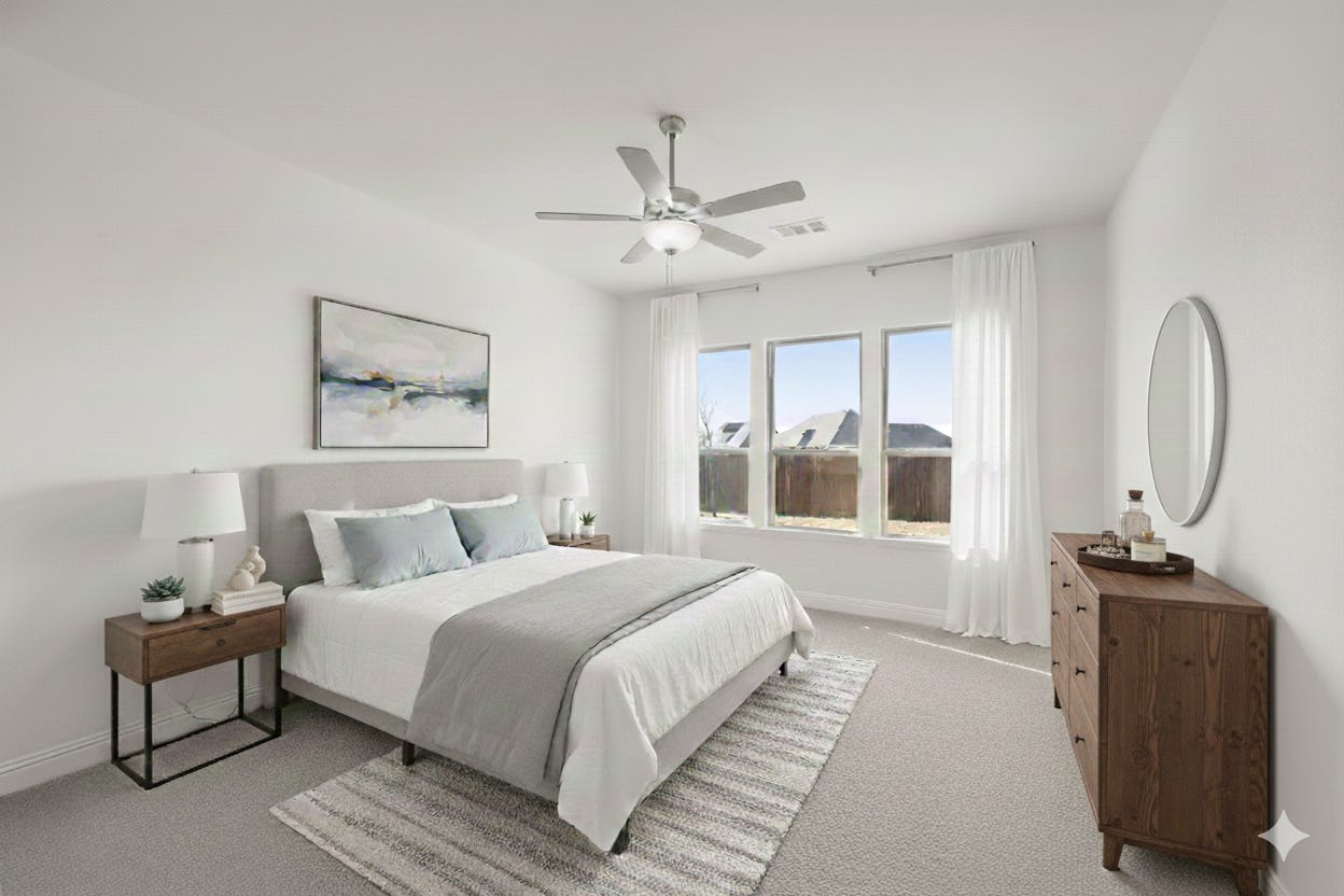 Virtually staged primary bedroom in the Cherry floor plan by Kindred Homes