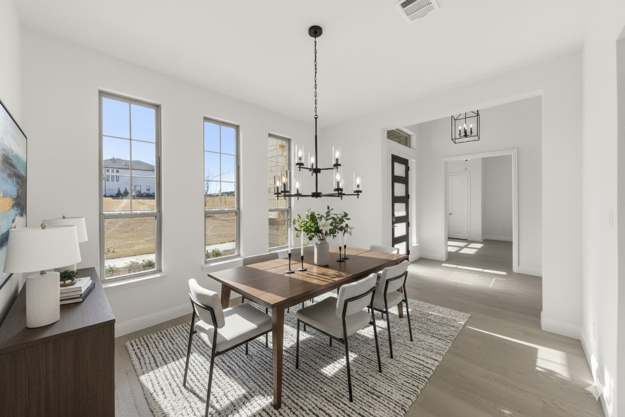 Virtually staged dining room in the Reid floor plan at Stoney Creek by Kindred Homes