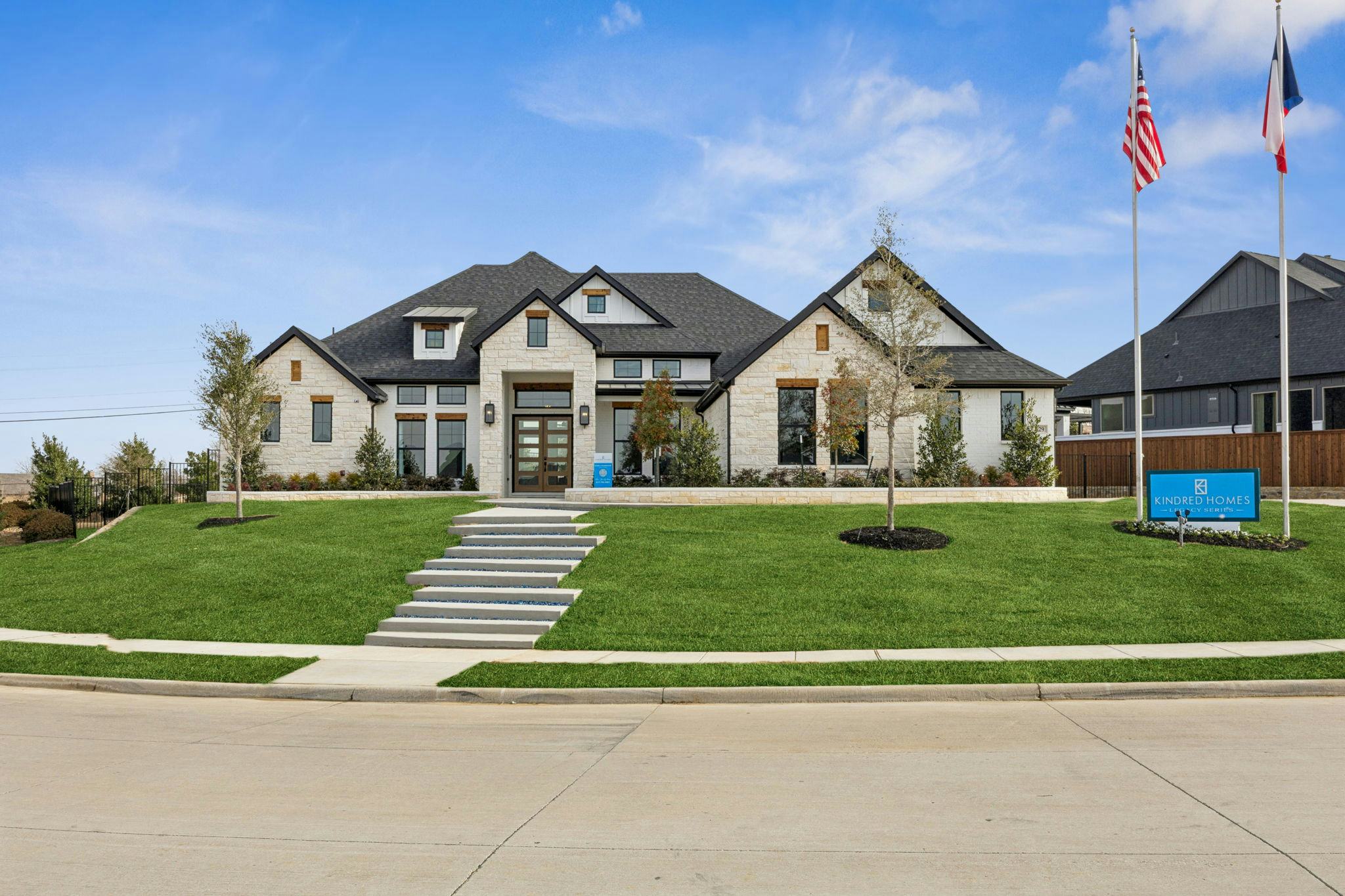 The front exterior of the custom model home at The Vines by Kindred Homes