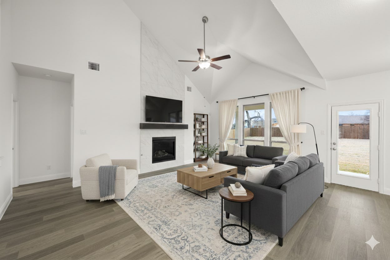 Virtually staged living room in the Willow floor plan at Stone Eagle by Kindred Homes