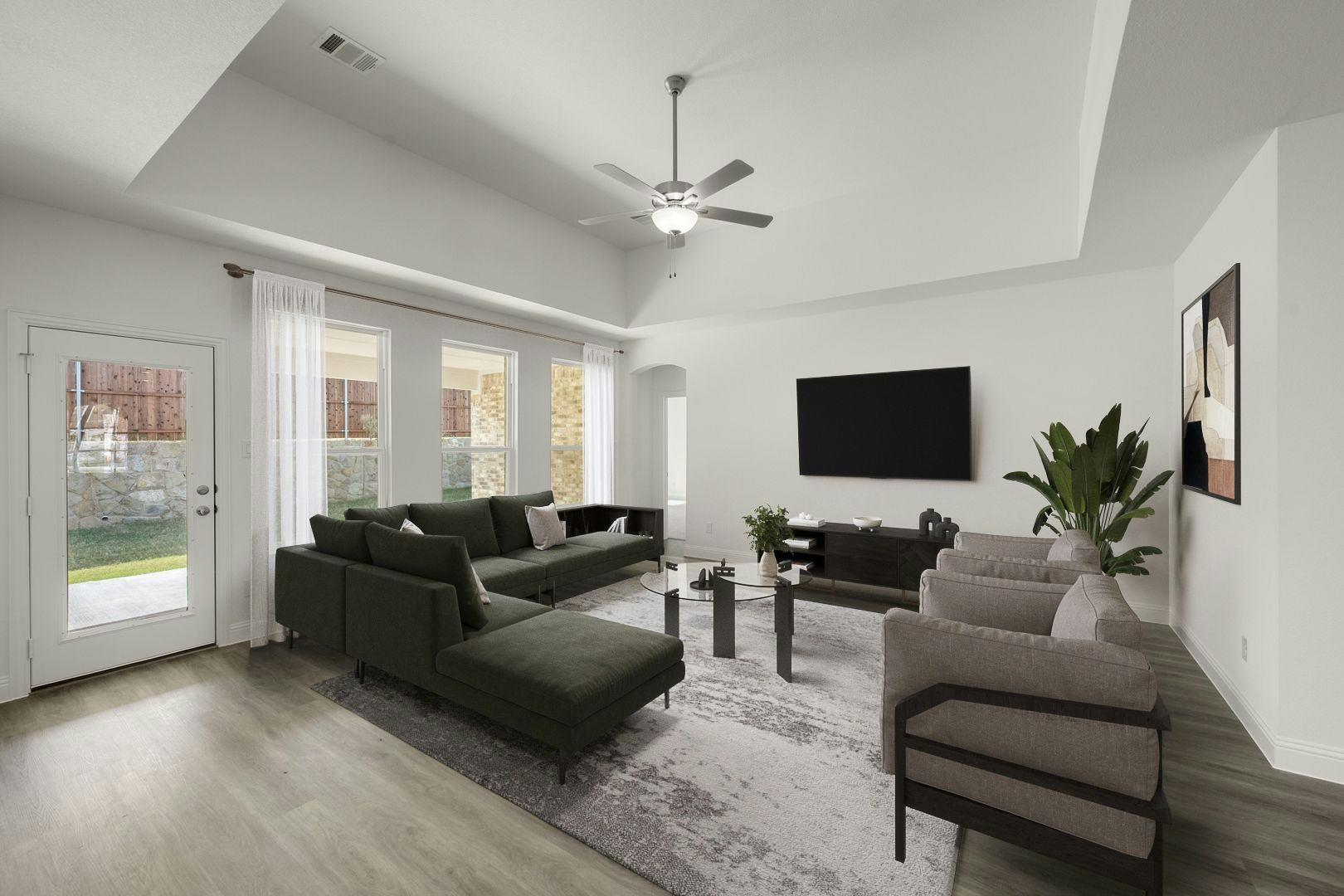 Virtually staged living room in the Seville floor plan at Westside Preserve by Kindred Homes