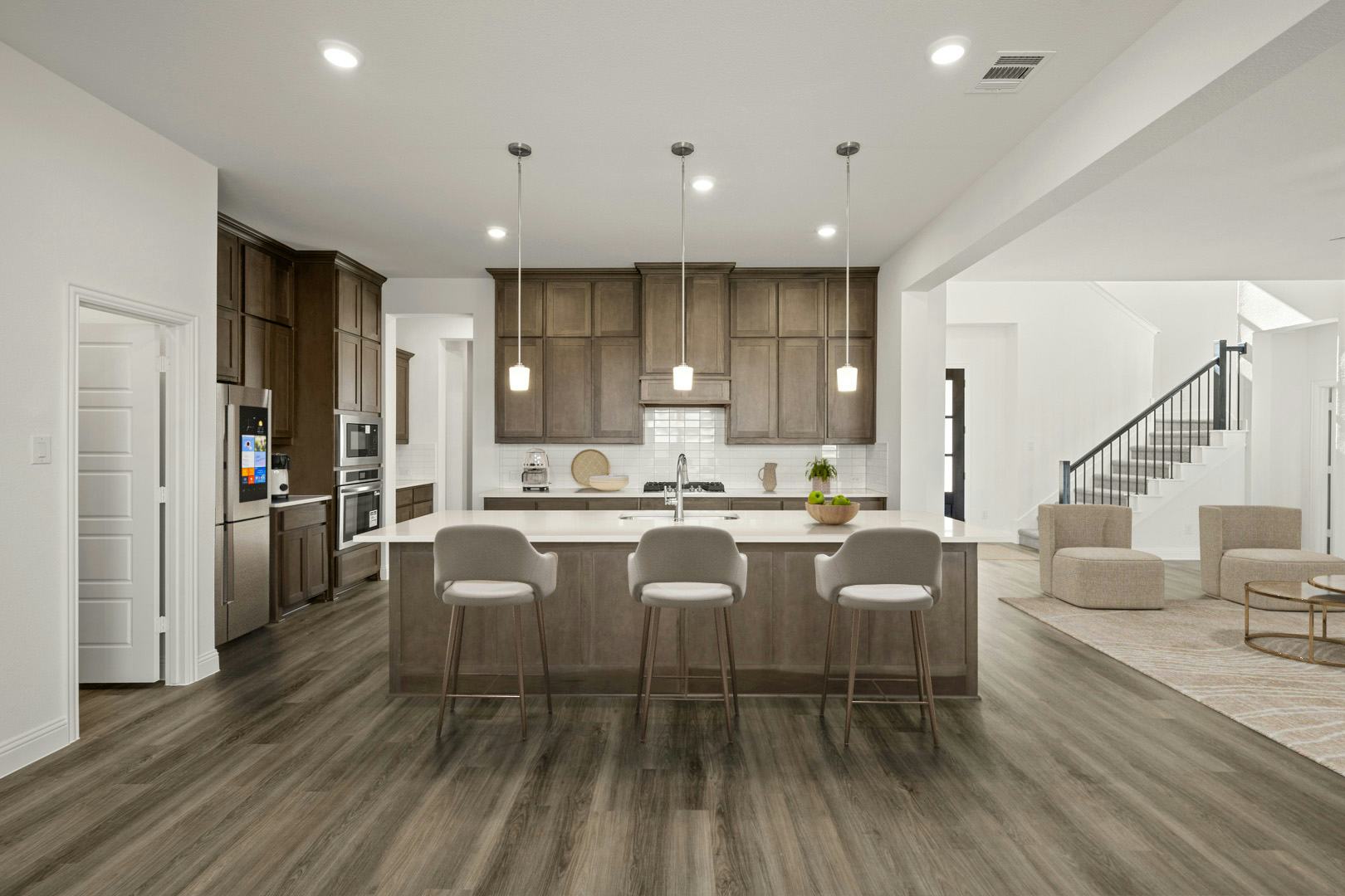 Virtually staged kitchen in the Villa floor plan at Kentsdale Farms by Kindred Homes