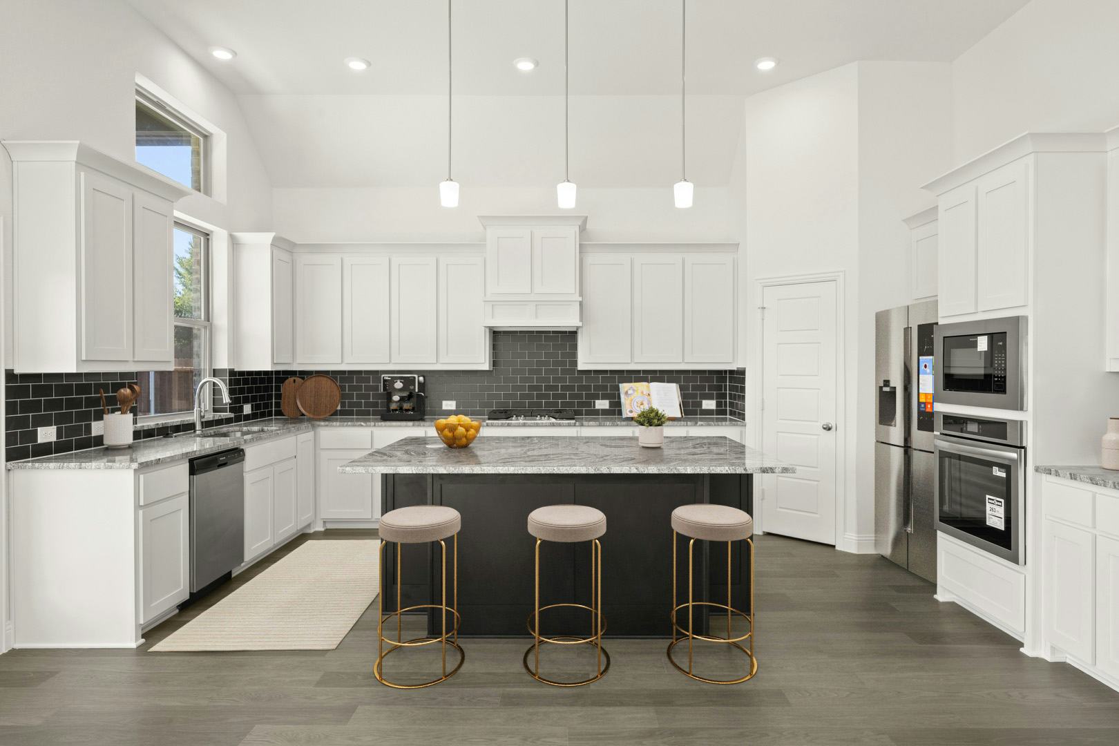 Virtually staged kitchen in the Manor floor plan at Kentsdale Farms by Kindred Homes