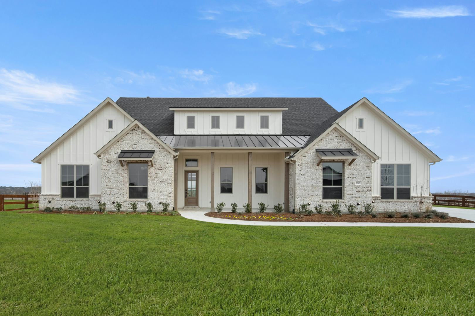 Exterior of a custom home at Highlands of Northlake by Kindred Homes