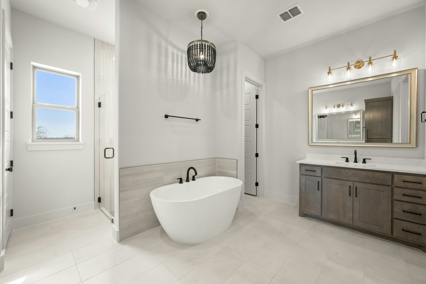 Primary bathroom in a custom home at Highlands of Northlake by Kindred Homes