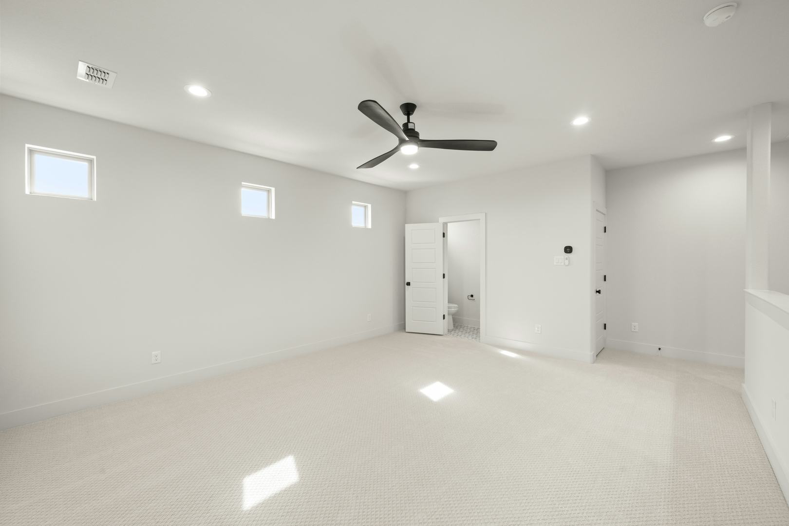 Game room in a custom home at Highlands of Northlake by Kindred Homes