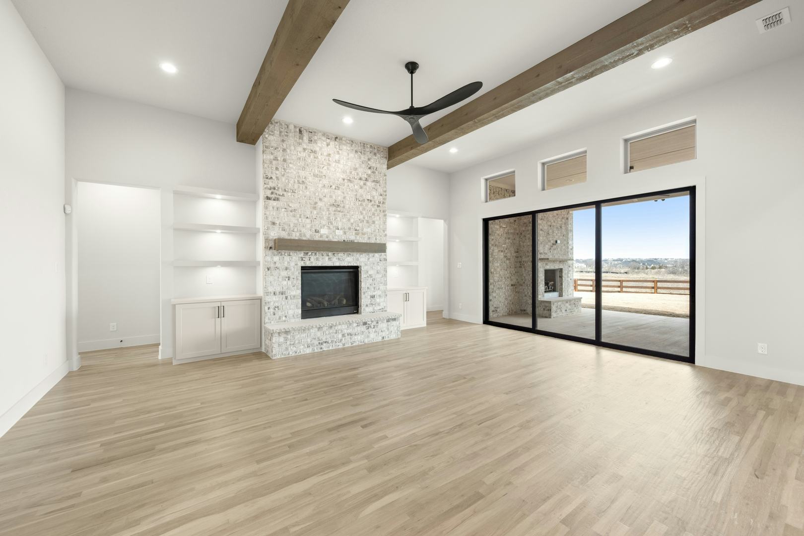 Living room in a custom home at Highlands of Northlake by Kindred Homes
