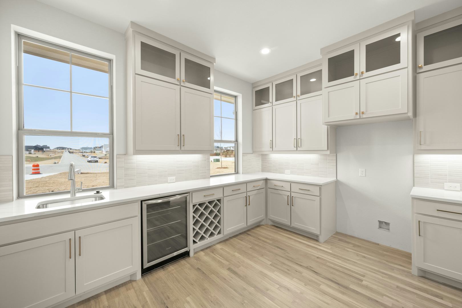 Prep kitchen in a custom home at Highlands of Northlake by Kindred Homes