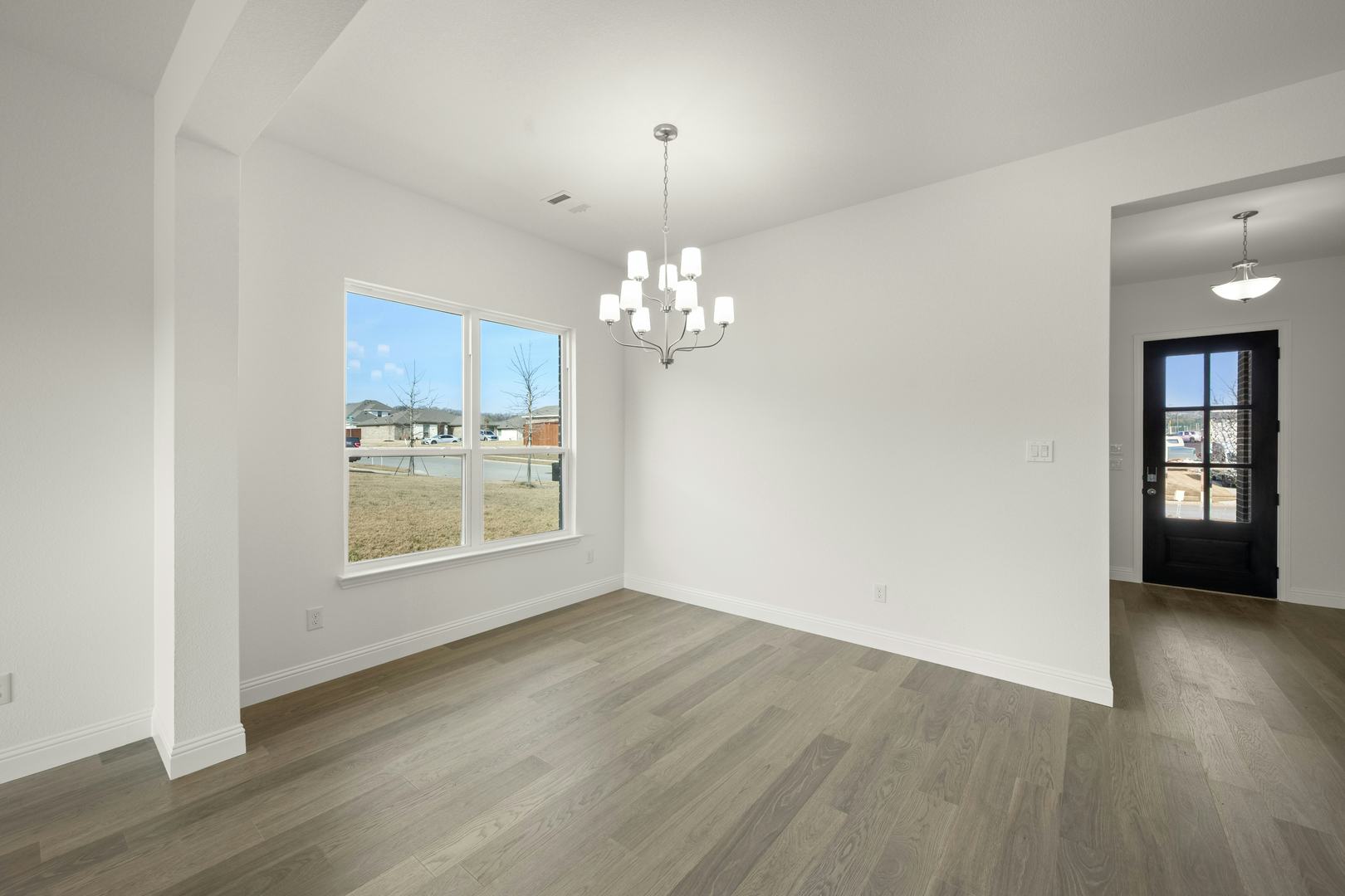 Dining room in the Cherry floor plan at Stone Eagle by Kindred Homes