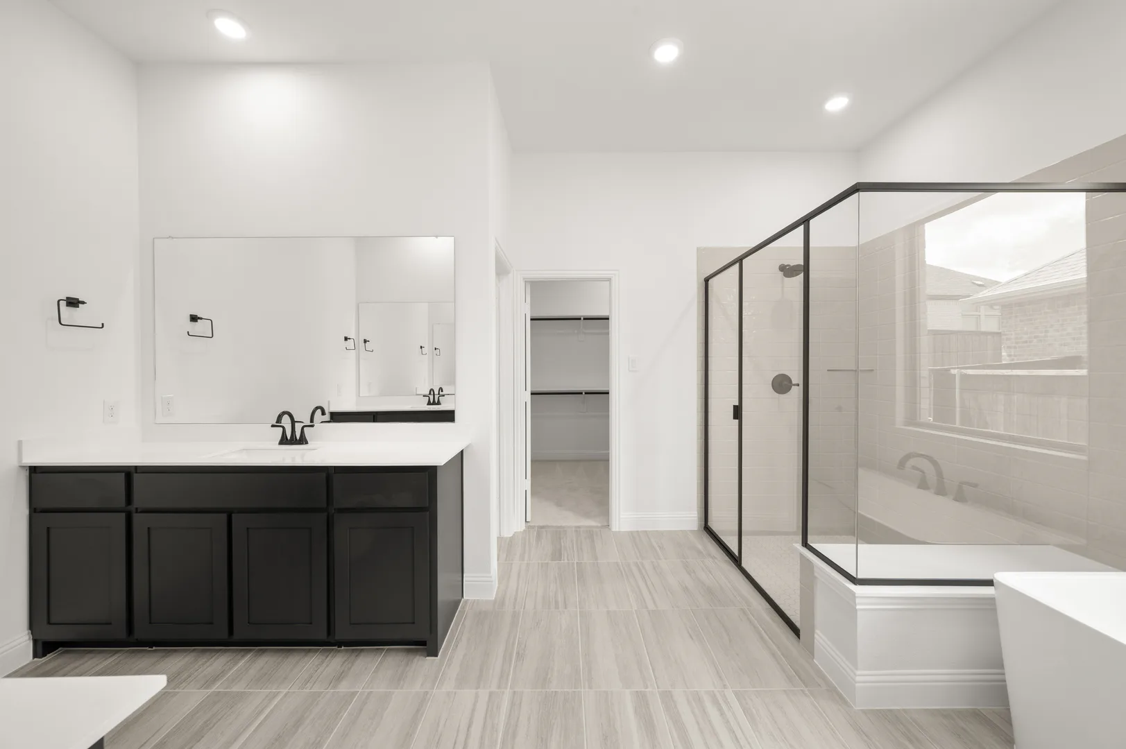 Primary bathroom with walk-in shower in available home at Westside Preserve by Kindred Homes in Midlothian