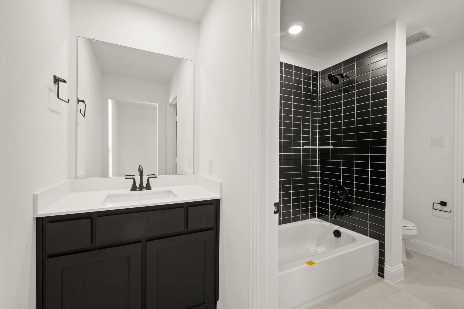 Secondary bathroom with bathtub in available home at Westside Preserve by Kindred Homes in Midlothian